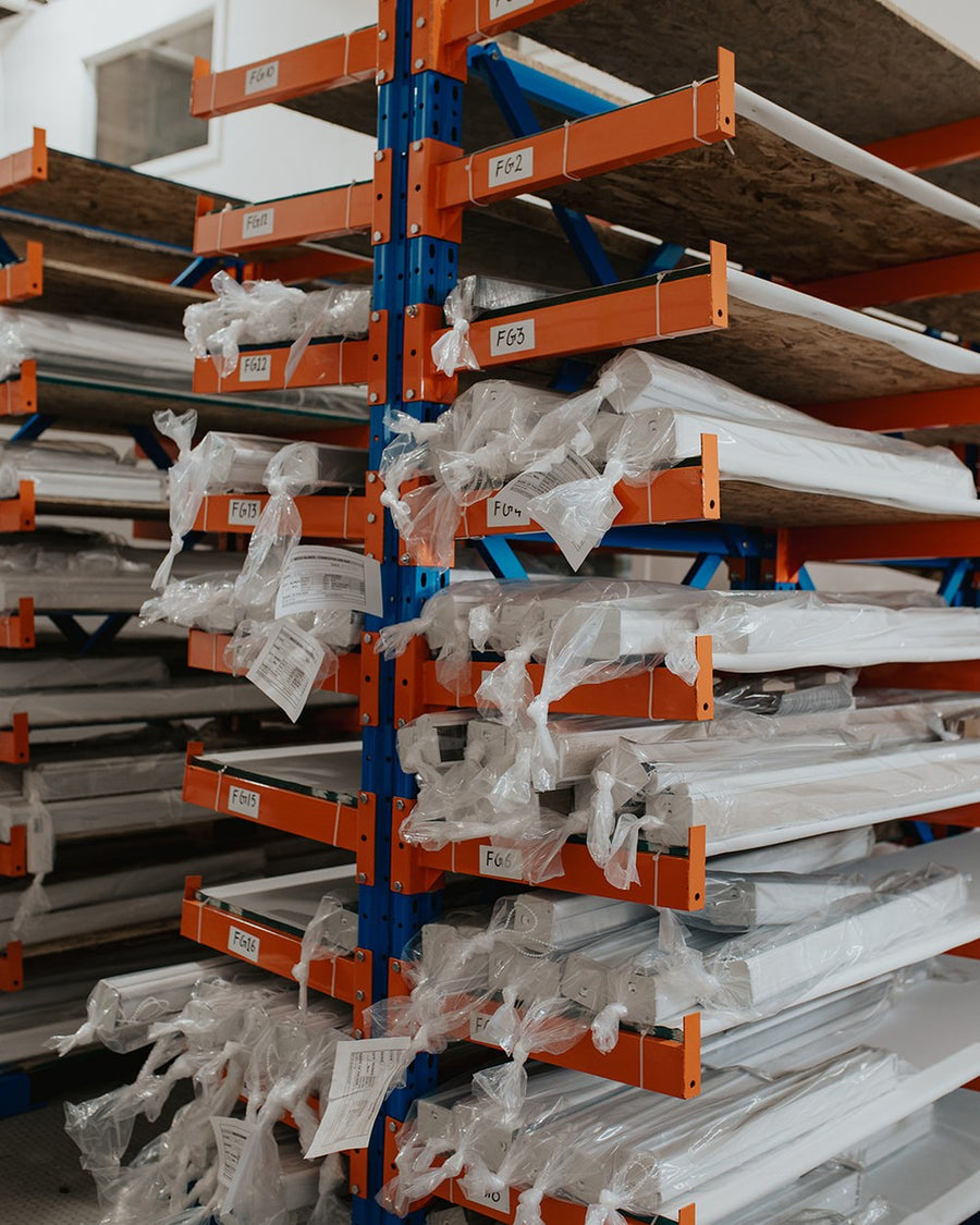 Finished custom blinds bagged and racked, ready to ship from Edmonton
