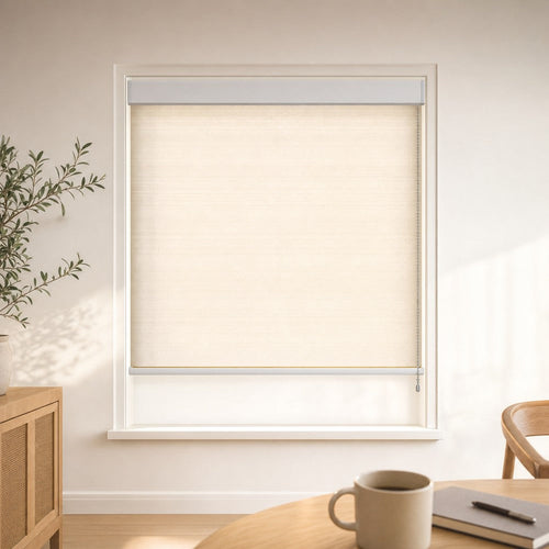 Custom light-filtering roller blind in Linen Beige with a white cassette, shown in a bright breakfast corner